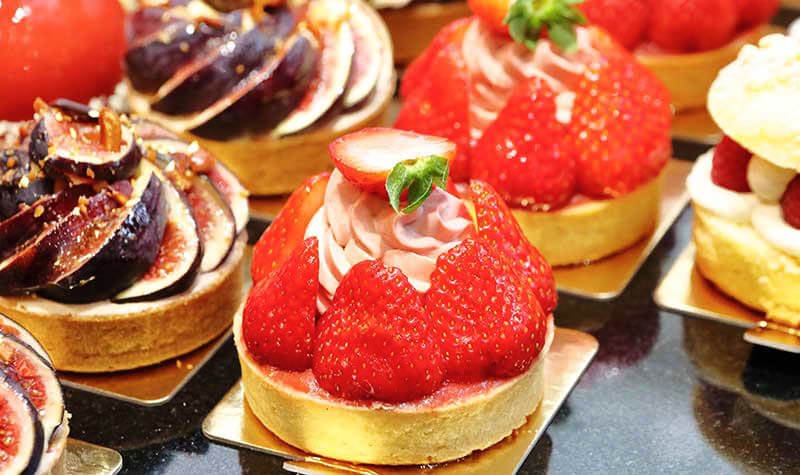 Parisian pastries with in the front a Tarte Fraises.